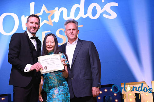 Dr. Yi receiving Orlando's Best award at 2025 ceremony